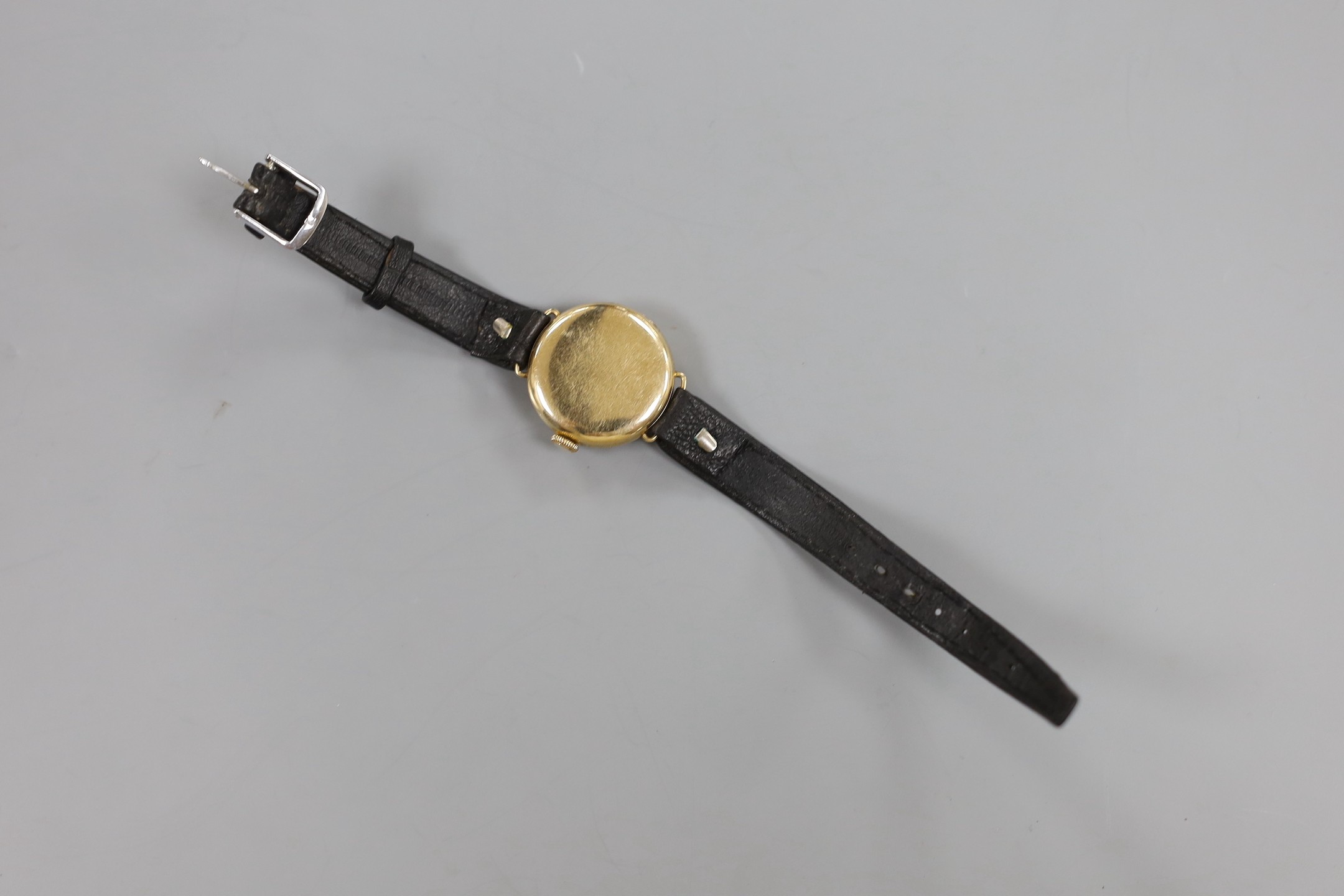A lady's 9ct gold Omega manual wind wrist watch, a 935 white metal fob watch with albert and a silver open faced pocket watch.